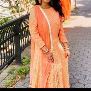 Beautiful Anarkali style gown with heavy work through out. Fits like medium.
